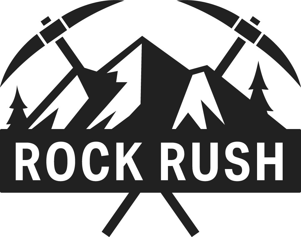 Rock Rush Logo, mountains, trees, and crossed pickaxes